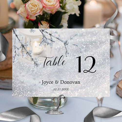 Sparkling snow with lantern winter wedding table number card